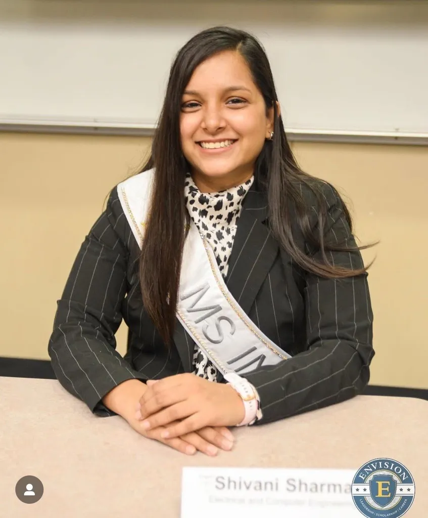 Image of Shivani Sharma in a blazer and sash